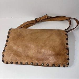Leather messenger style bag made in Italy tan with studs